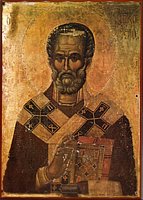 На бывшей храмовой иконе, долгие годы использовавшейся в качестве двери, проявился образ св.Николая